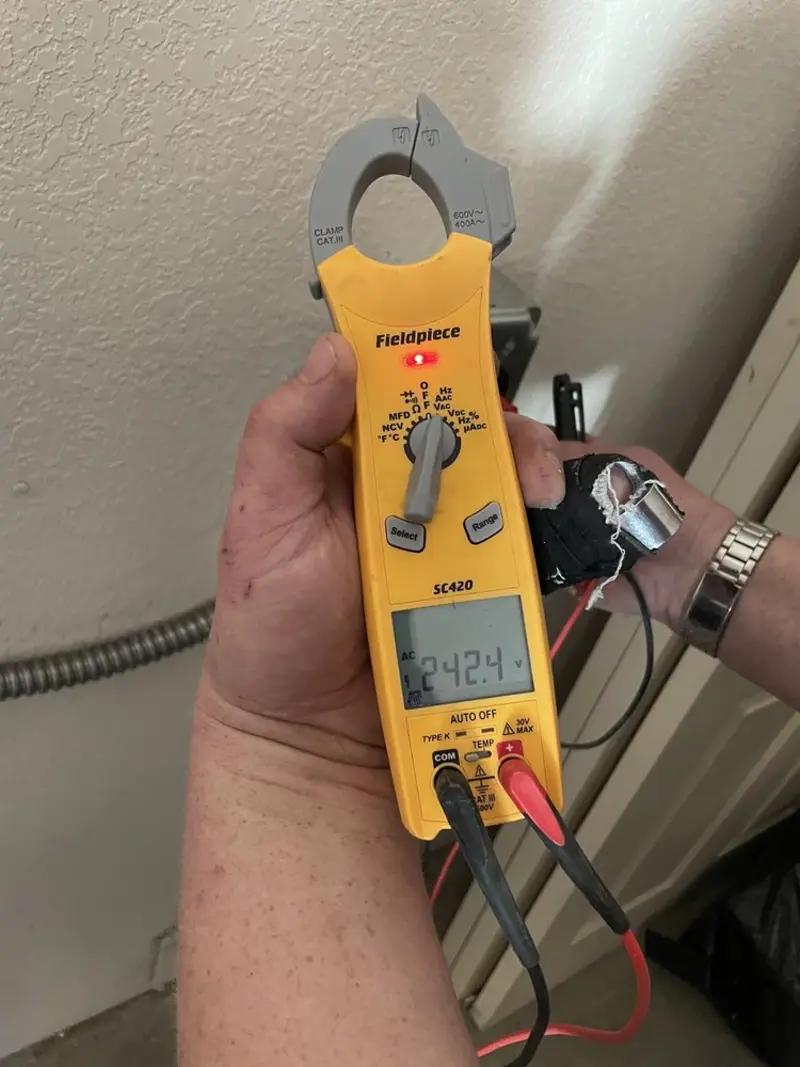 Voltage testing with clamp meter during Ceiling Fan Installation in Norfolk